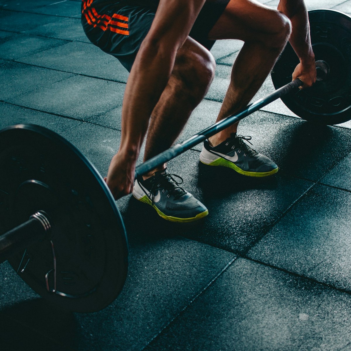 Loaded barbell resting on the platform