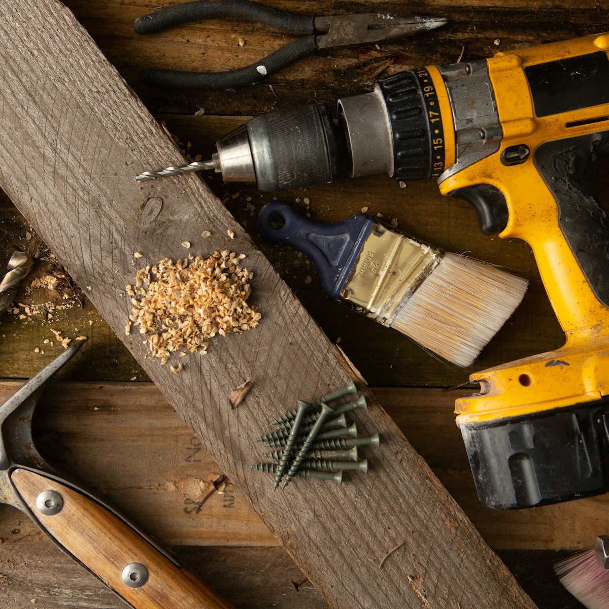 Child sanding a piece of pine